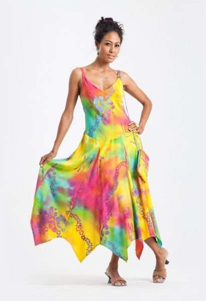 Woman in colorful flowing summer dress posing