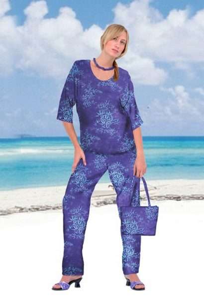 Woman in blue beachwear outfit on tropical beach