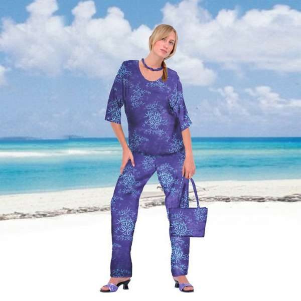 Woman in blue beachwear outfit on tropical beach