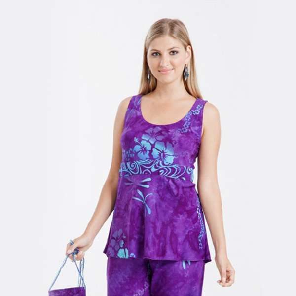 Woman in purple floral tank top smiling