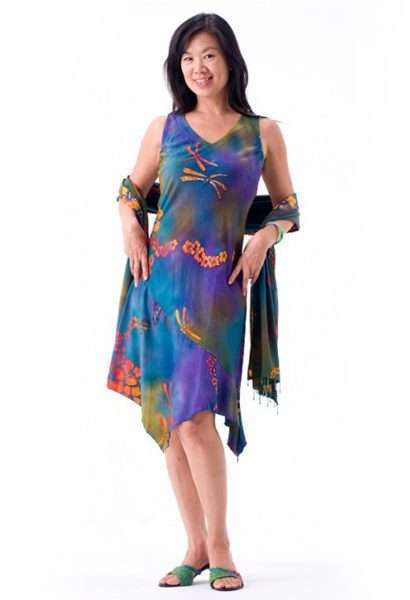 Woman in colorful asymmetrical dress smiling