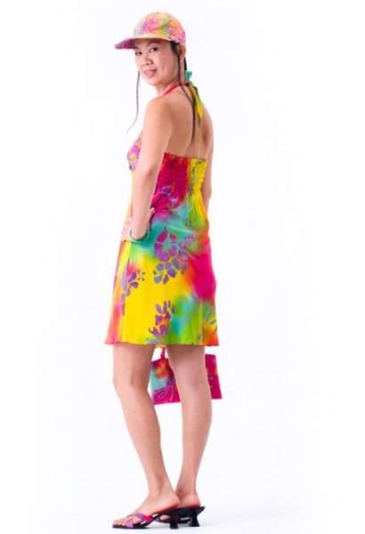 Woman in colorful summer dress and matching hat