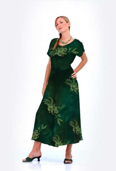 Woman in green floral dress posing