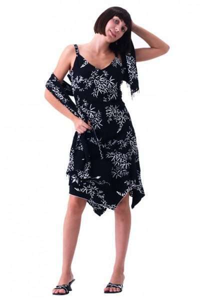 Woman posing in black floral asymmetric dress