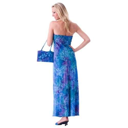 Woman in blue floral dress with matching bag