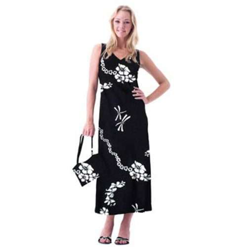 Woman in black floral dress holding matching bag