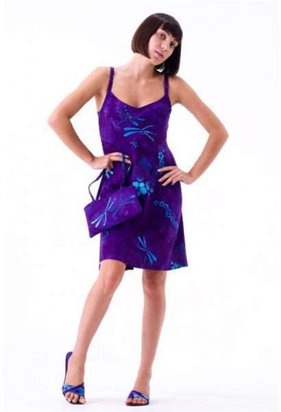 Woman in purple floral dress with matching accessories