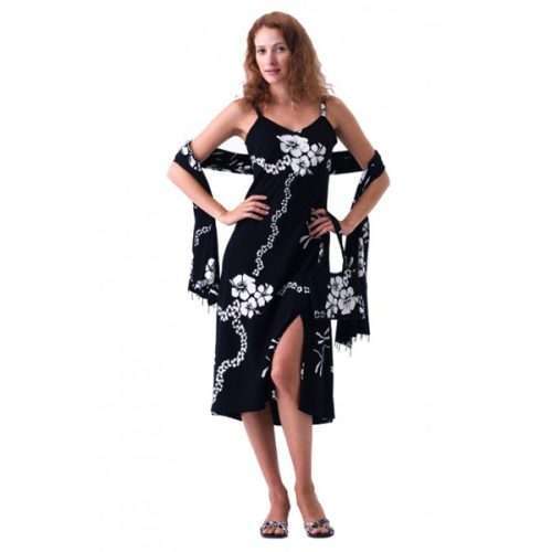 Woman in black floral dress posing confidently