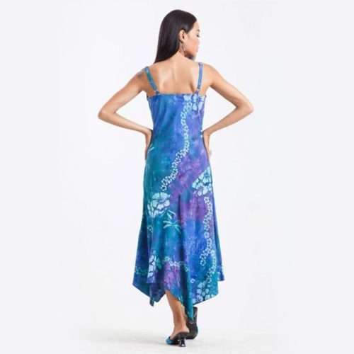 Woman in blue floral asymmetrical dress, rear view