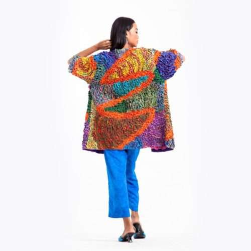 Woman modeling colorful oversized knit sweater