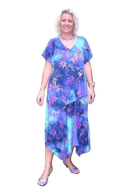Woman in blue floral dress smiling