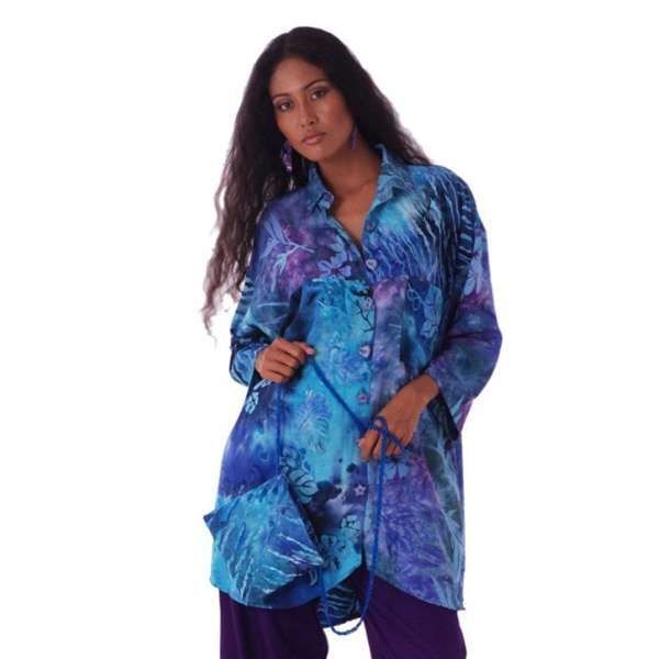 Woman wearing blue tropical batik resort blouse